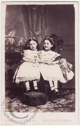 Two girls with dolls