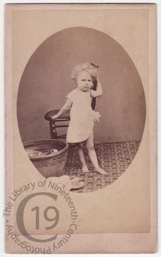 Child with tin bathtub