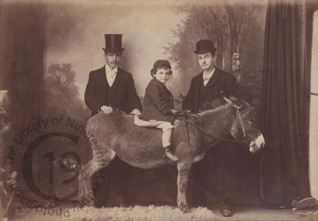 Unidentified sitters with donkey