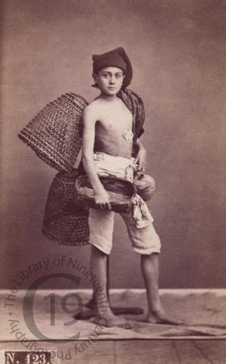 Young fisherman with lobster pots