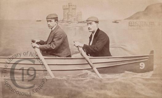 Two men in a fake rowing boat