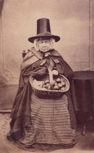 An elderly Welsh woman with apples