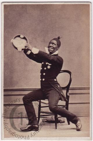 Blackface clown with tambourine 