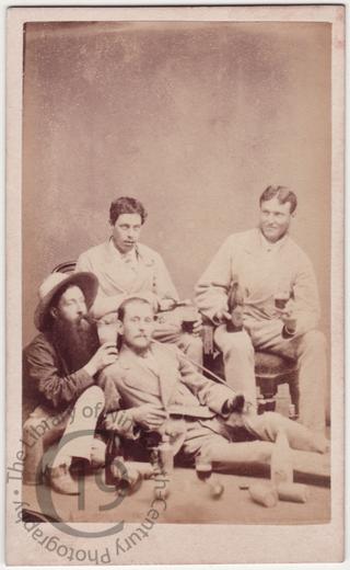 Four men drinking beer