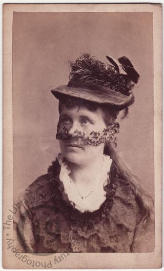 Hat with half-veil