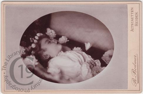 Child with wreath of flowers