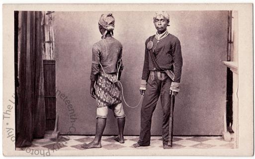 Javanese policeman with prisoner